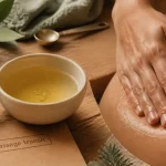 Huiles essentielles et constipation : massage abdominal au gingembre et huile en gouttes